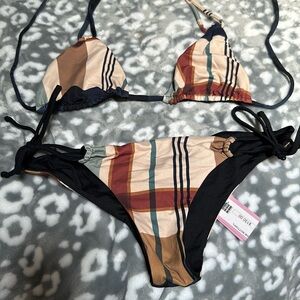 San Lorenzo fits like a small! Reversible bikini is brand new!